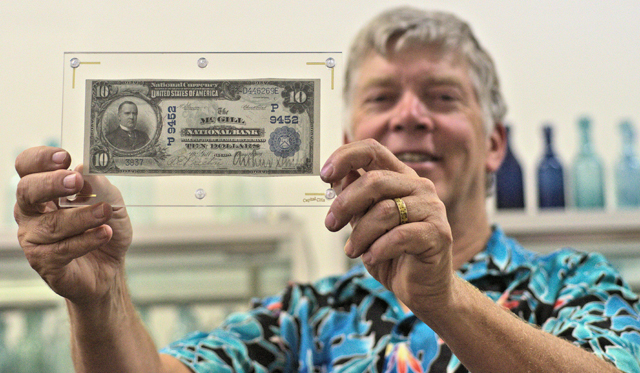 Fred Holabird holds McGill National Bank note